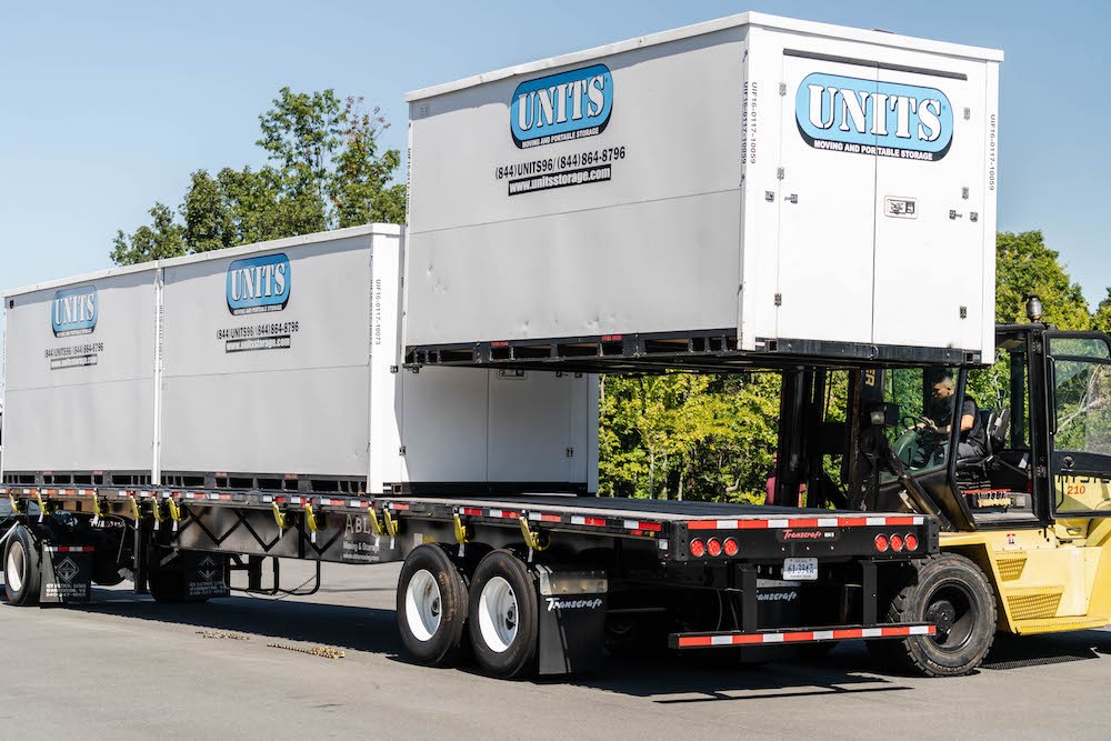 image of three portable storage containers on the bed of a truck