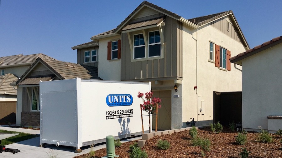 image of a house with a portable storage container in the driveway