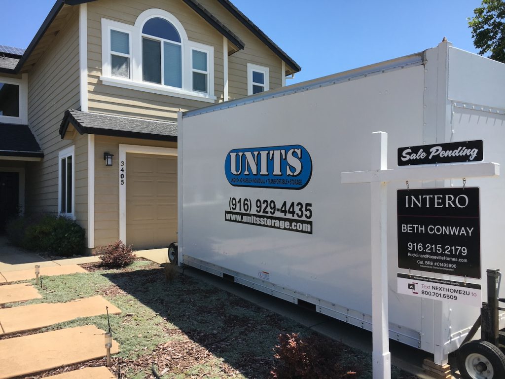image of a house for sale with a units portable storage in Fairfield, ca container in the driveway