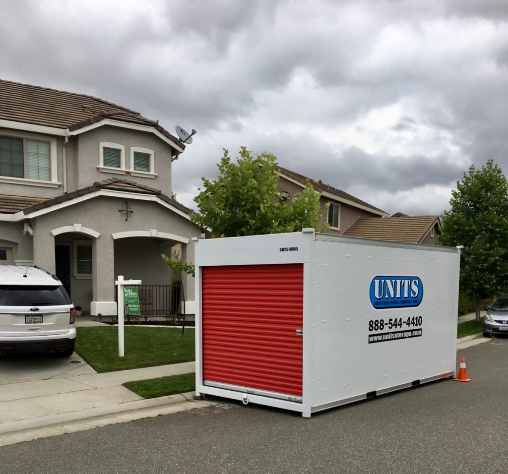 units portable storage in Auburn contianer on the street in front of a home as people move in