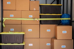 Boxes and totes loaded and secured inside a UNITS container
